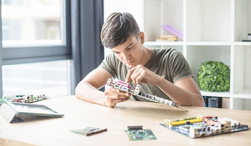 Student working on advanced Innovation Engineers robotics project